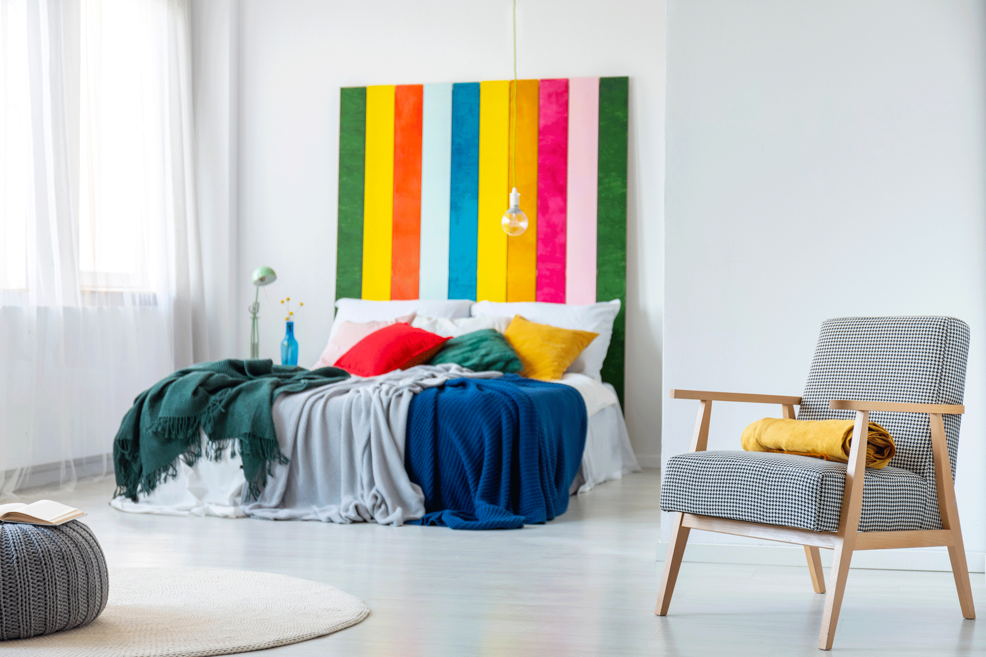 Psychology-of-Colours-2 Modern Bedroom with accent chair and colourful bed.